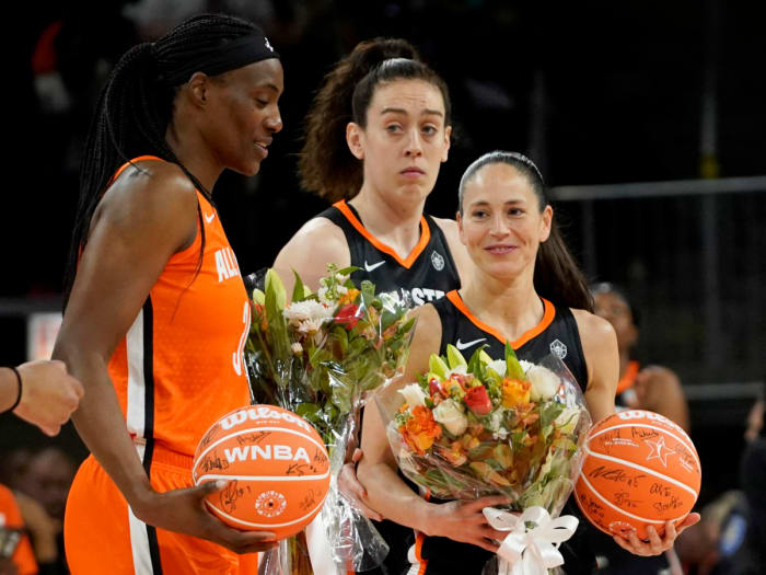 Sue Bird Sylvia Fowles are presented with flowers during the first half in a WNBA All Star Game.